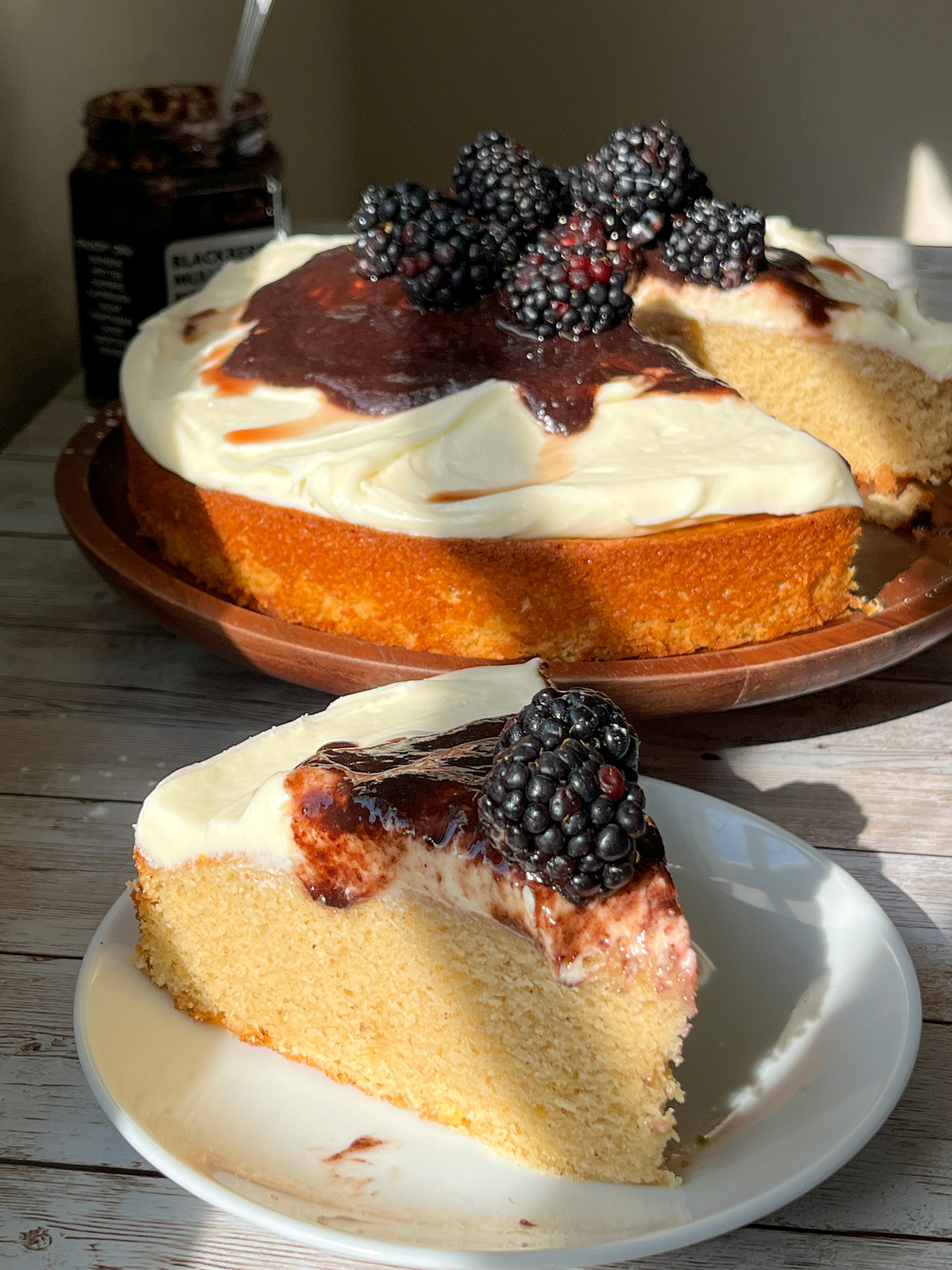 Spiced cake with blackberry merlot jam and cream cheese frosting