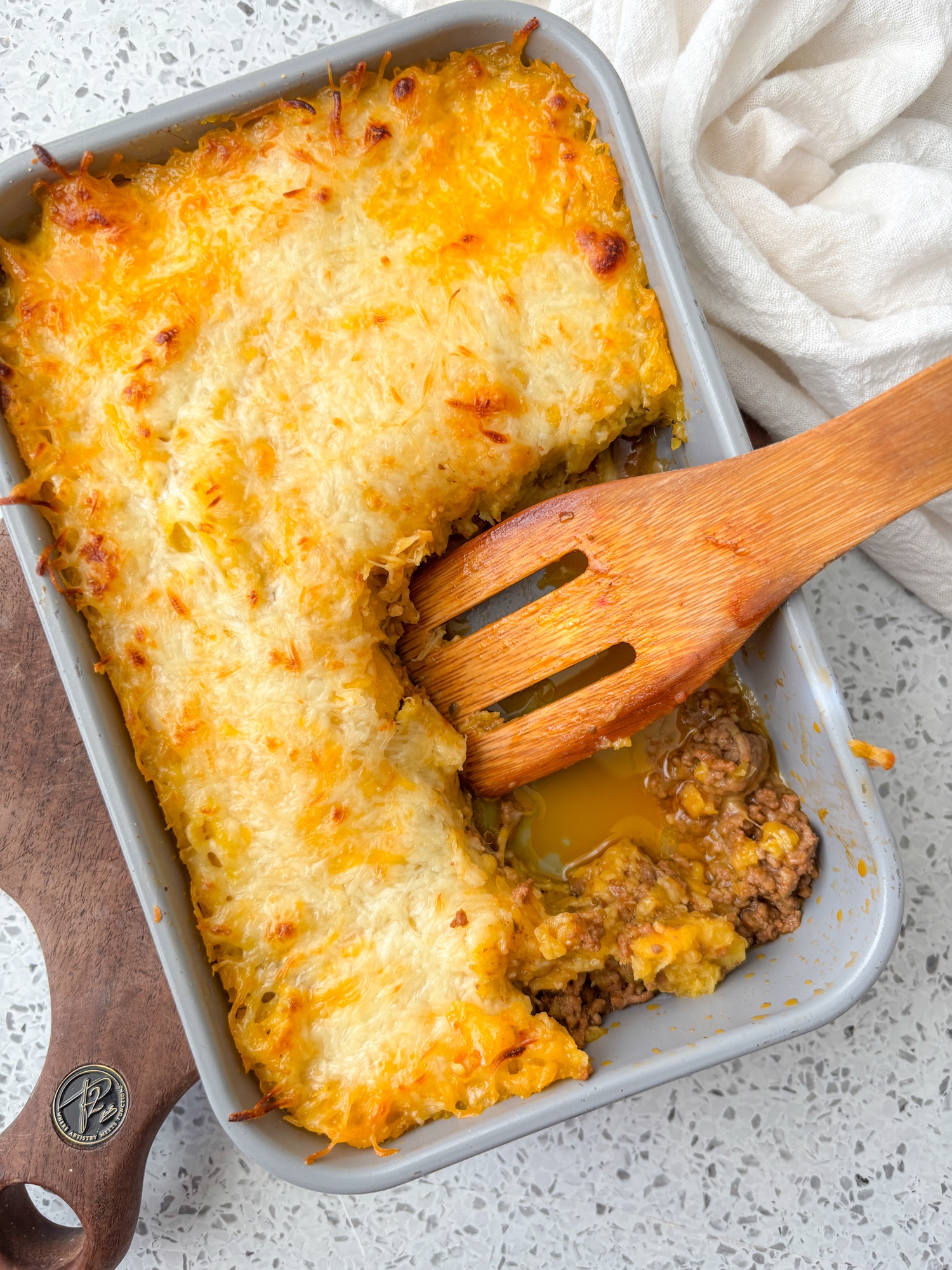 pastelon layered with cheese, ground beef and sweet plantains